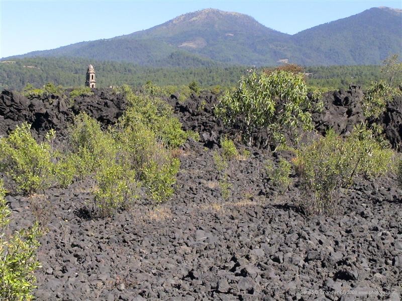 Old San Juan church tower and Paracutin Volcano