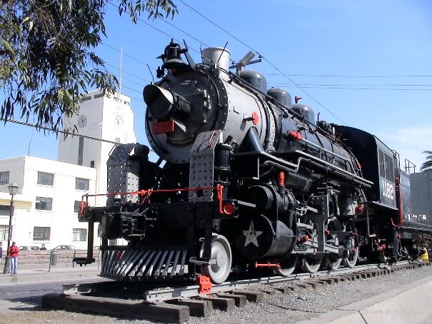 Railroad Engine in front of Closed Train Station